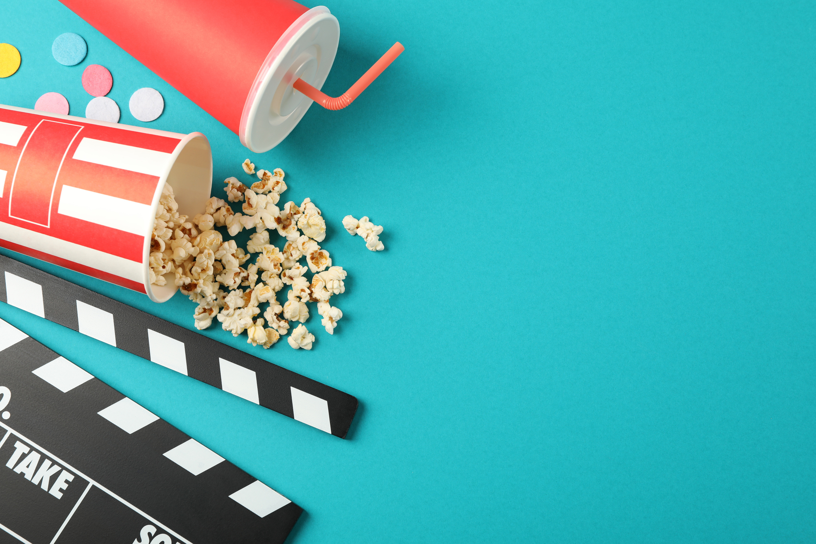 Flat Lay. Drink, Bucket with Popcorn, Clapperboard and Confetti